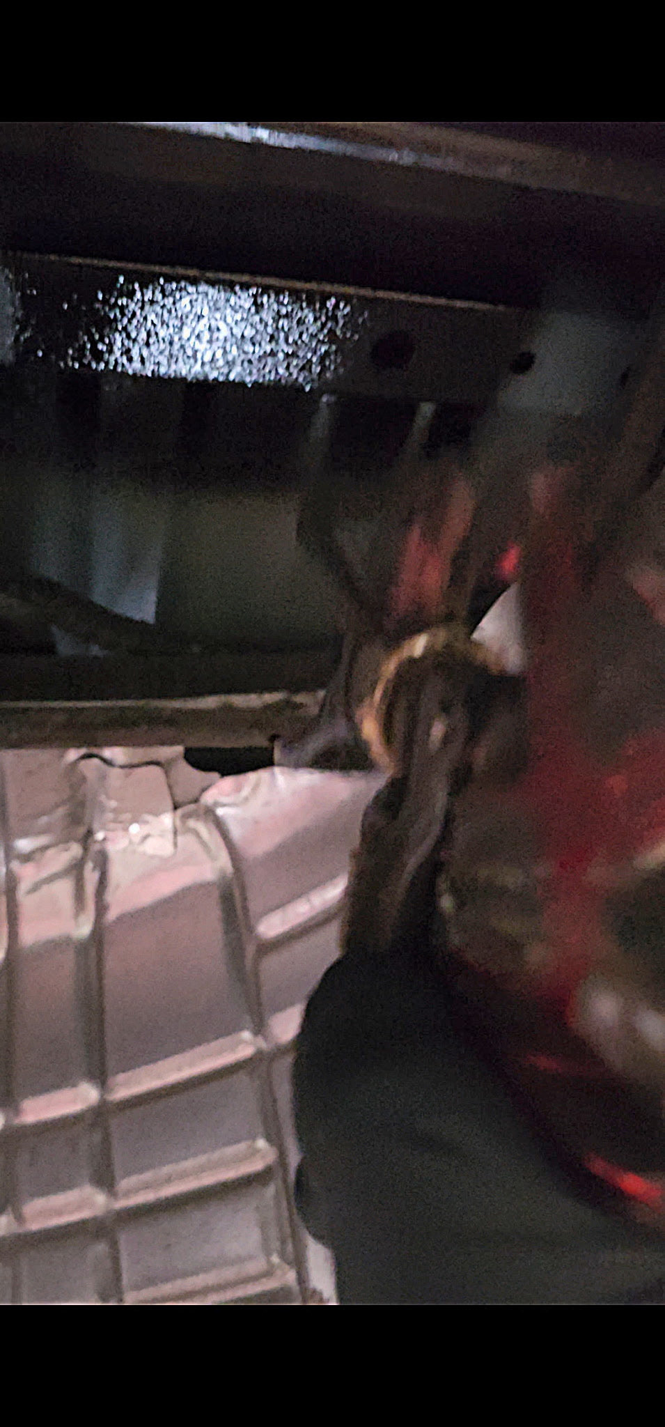 Close-up of undercoating on a vehicle frame