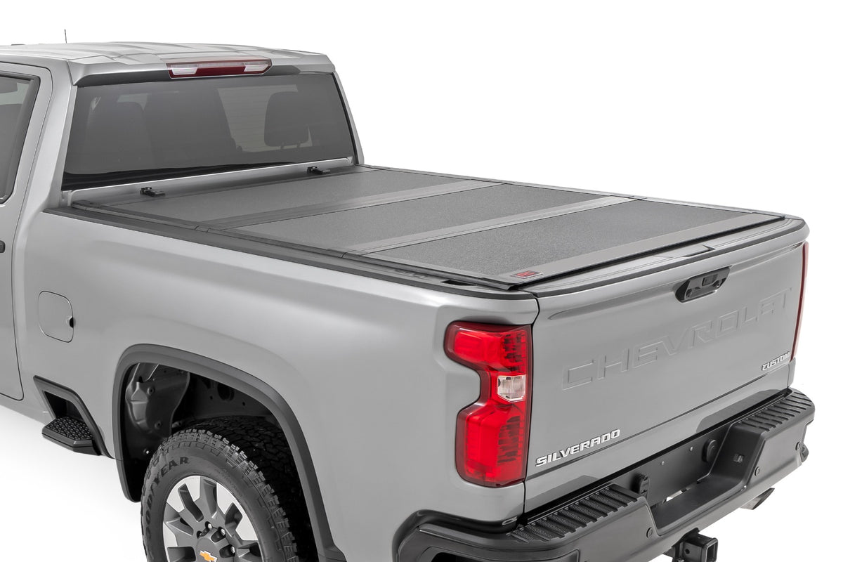 Hard Tri-Fold Flip Up Bed Cover | 6'9" Bed | Chevy/GMC Silverado/Sierra 2500HD/3500HD (20-26)